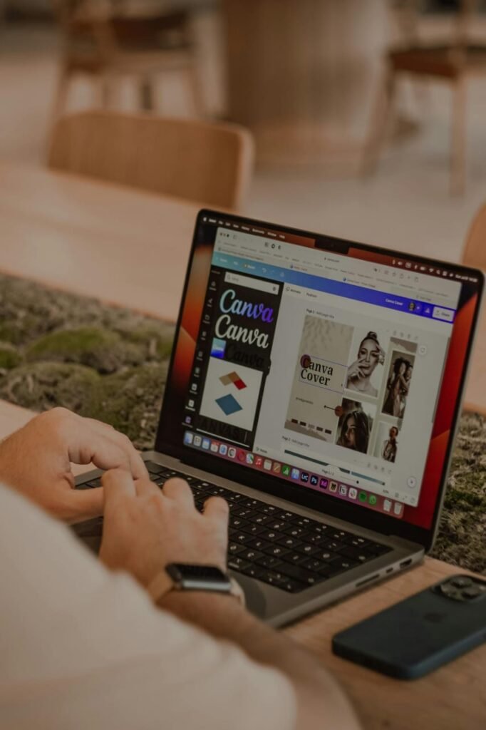 Person editing through canva on laptop Person editing through canva on laptop