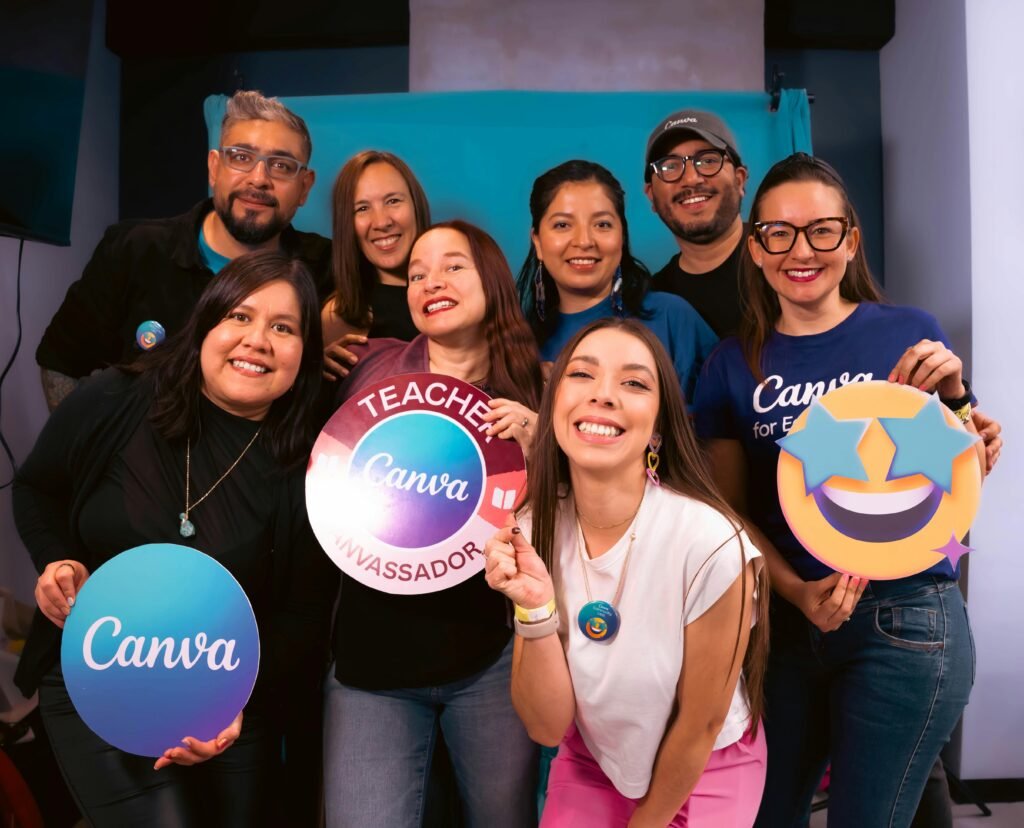 pexels photo 29588333 29588333 A diverse group of adults smiling and holding Canva branded signs, showcasing teamwork and creativity.